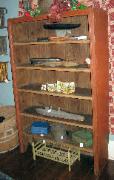 Painted red open crock cupboard or shelf